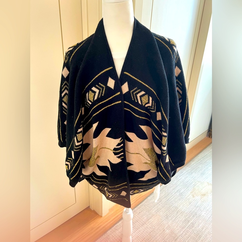 Parisian Etam Sweater Shawl with black, pink, and gold detailing.